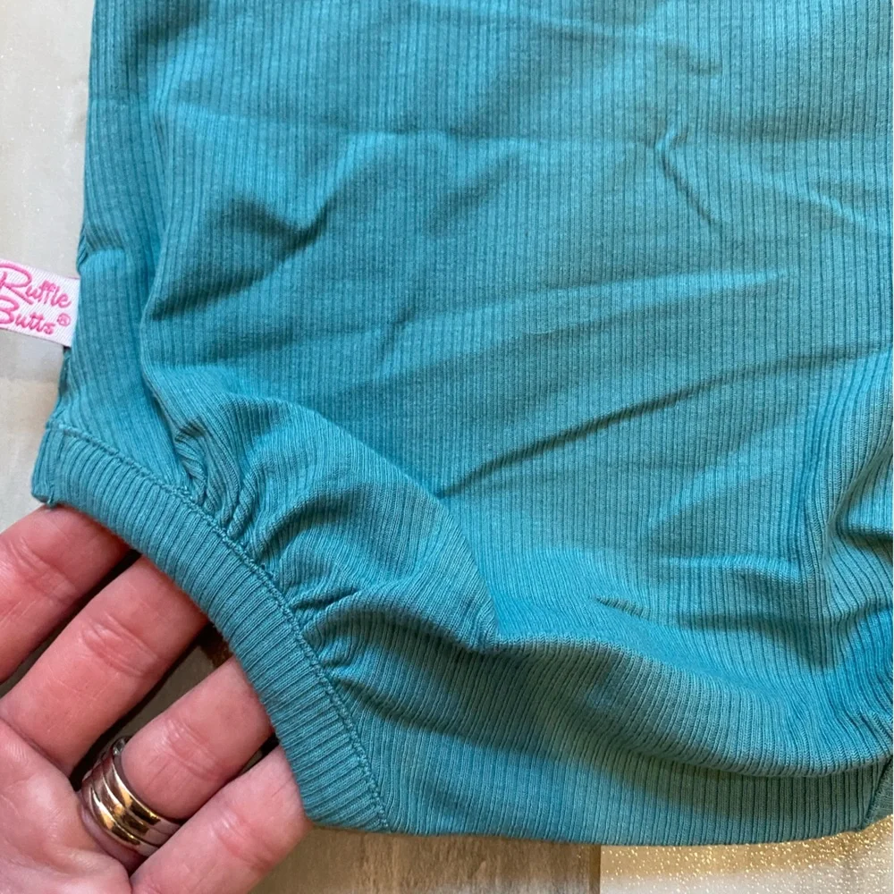 NWT RuffleButts Brittany Blue Rib Knit Long Sleeve Flutter Ruffle Bodysuit, 0-3M